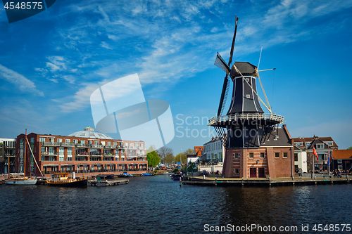 Image of Harlem landmark  windmill De Adriaan on Spaarne river. Harlem,  