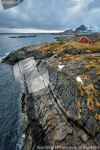 Image of Clif with traditional red rorbu house on Lofoten Islands, Norway