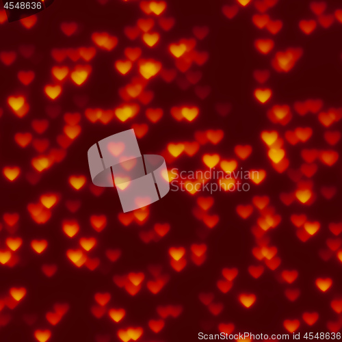 Image of glowing hearts bokeh red seamless background