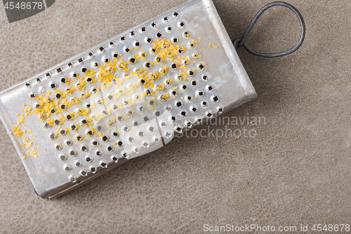 Image of Metal scraper with lemon zest