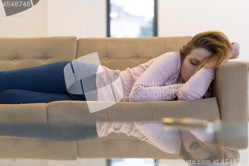 Image of Woman Sleeping On Sofa