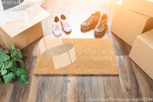 Image of Home Sweet Home Welcome Mat, Moving Boxes, Women and Male Shoes 