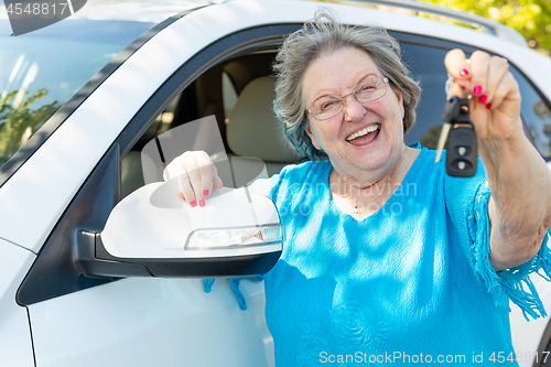 Image of Happy Senior Woman With New Car and Keys