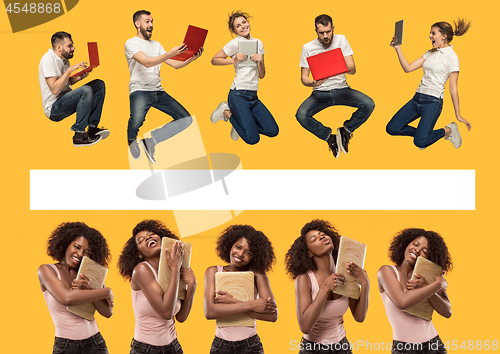 Image of The happy young jumping women and men with laptops