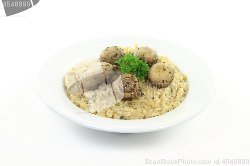 Image of Fried white mushrooms on rice. 