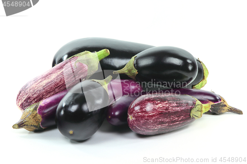 Image of Pile assorted Eggplants on white. 