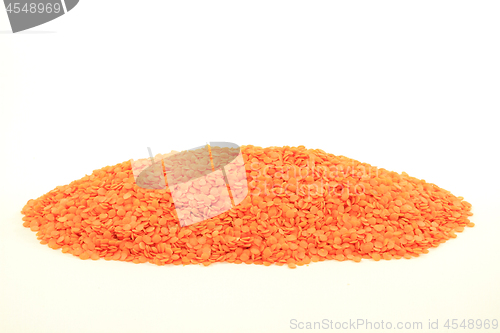 Image of Red Lentil spilled on pile. 