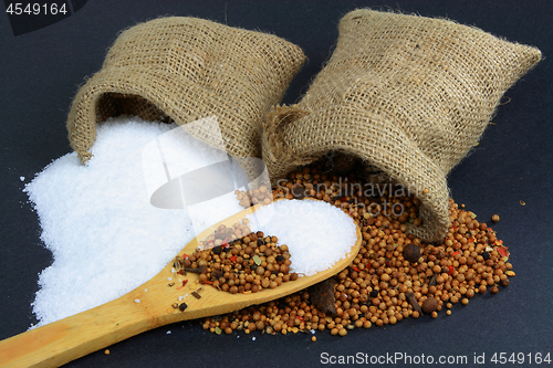Image of Spilled Pickling Salt and Pickling Spice. 