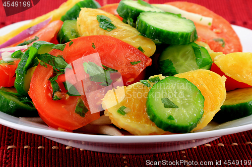 Image of Close-up view of mixed fruits and vegetables salad. 