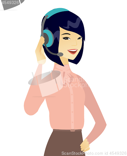 Image of Young asian customer service operator in headset.