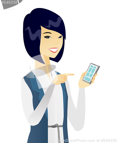 Image of Young asian business woman holding mobile phone.