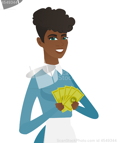 Image of Young african-american cleaner holding money.