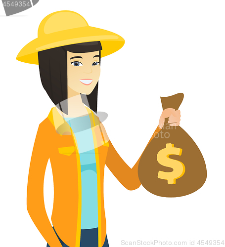 Image of Young asian farmer holding a money bag.