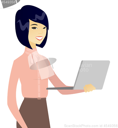 Image of Young asian business woman using a laptop.