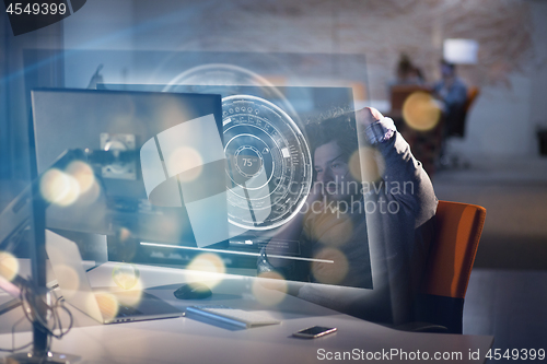 Image of businessman relaxing at the desk