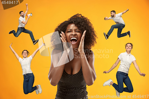 Image of Beautiful woman looking suprised and running and jumping man and girl