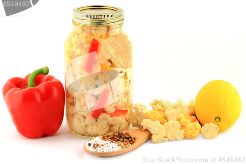 Image of Ingredients for pickling cauliflower in a jar