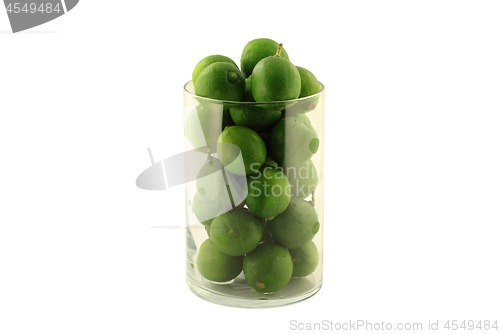 Image of Key Limes in Glass Cylinder on white. 