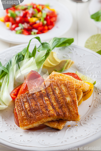 Image of Grilled hallumi cheese with tomato salad and fresh onion