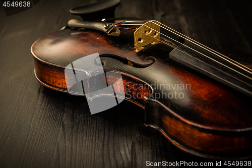 Image of Close view of old violin and strings in vintage style