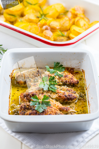 Image of Chicken parmigiana - parmesan chicken  with baked potatos