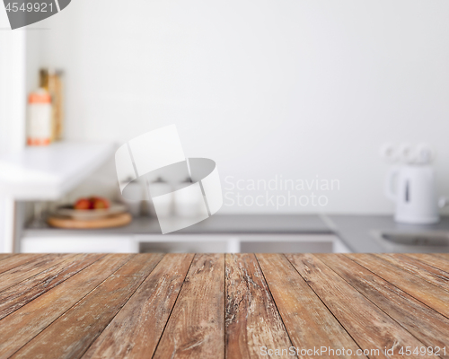 Image of blurred kitchen background with wooden boards