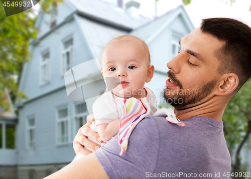 Image of father with little baby daughter