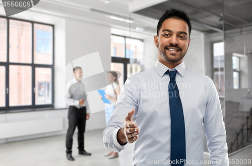 Image of businessman or realtor giving hand for handshake