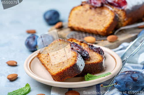 Image of Slices of traditional plum cake on ceramic plate.