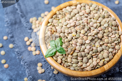 Image of Brown organic dried lentils close up.