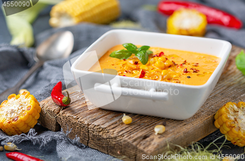 Image of Delicious creamy corn soup with chili in a bowl.