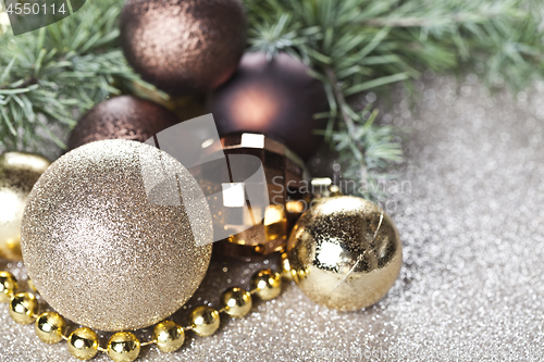 Image of Christmas decorations and evergreen fir tree branch.