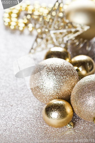 Image of Christmas golden and brown decorations closeup on glitter backgr