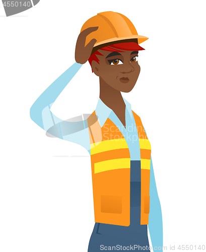 Image of Young african-american builder scratching head.