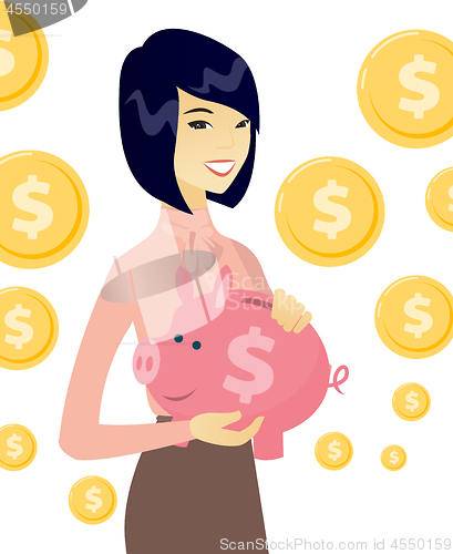 Image of Young asian business woman holding a piggy bank.