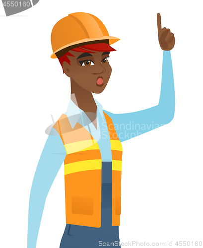 Image of African builder with open mouth pointing finger up