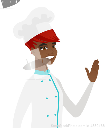 Image of Young african-american chef waving her hand.