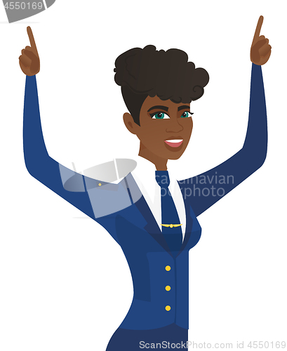 Image of African stewardess standing with raised arms up.