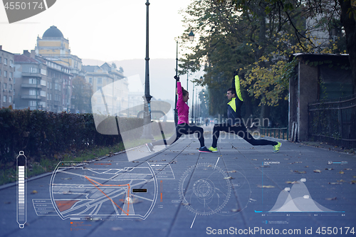 Image of Man and woman stretching on the street