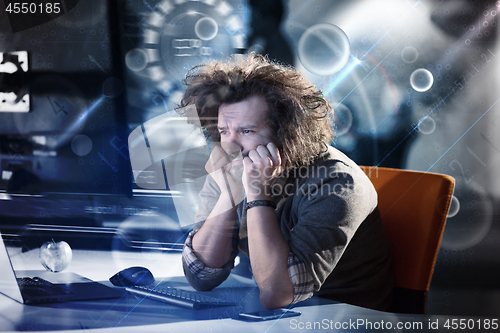 Image of businessman relaxing at the desk