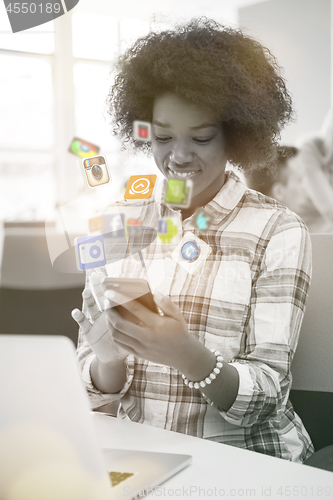 Image of African American informal business woman working in the office