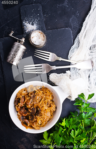 Image of fried cabbage with mushrooms