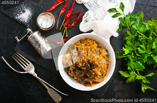 Image of fried cabbage with mushrooms