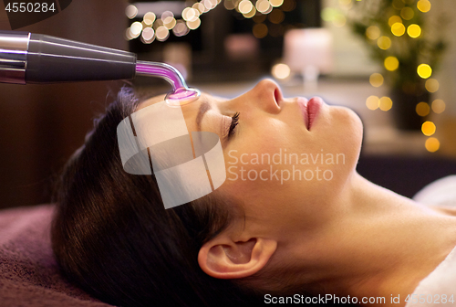 Image of woman having hydradermie facial treatment in spa