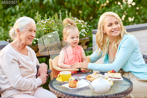 Image of mother, daughter and grandmother at cafe