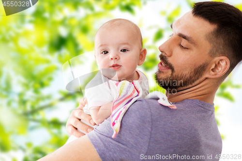 Image of father with little baby daughter