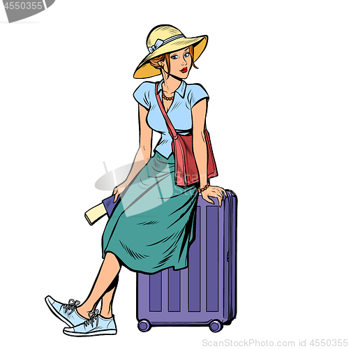 Image of woman tourist sitting on a travel suitcase