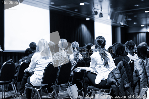 Image of Audience in the lecture hall attending scientific business conference.