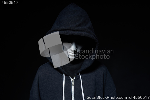 Image of Boy with Halloween zombie makeup with hood on