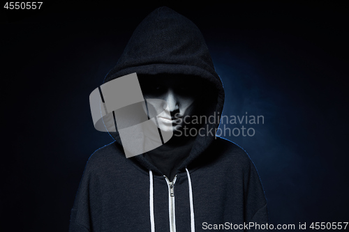 Image of Boy with Halloween zombie makeup with hood on